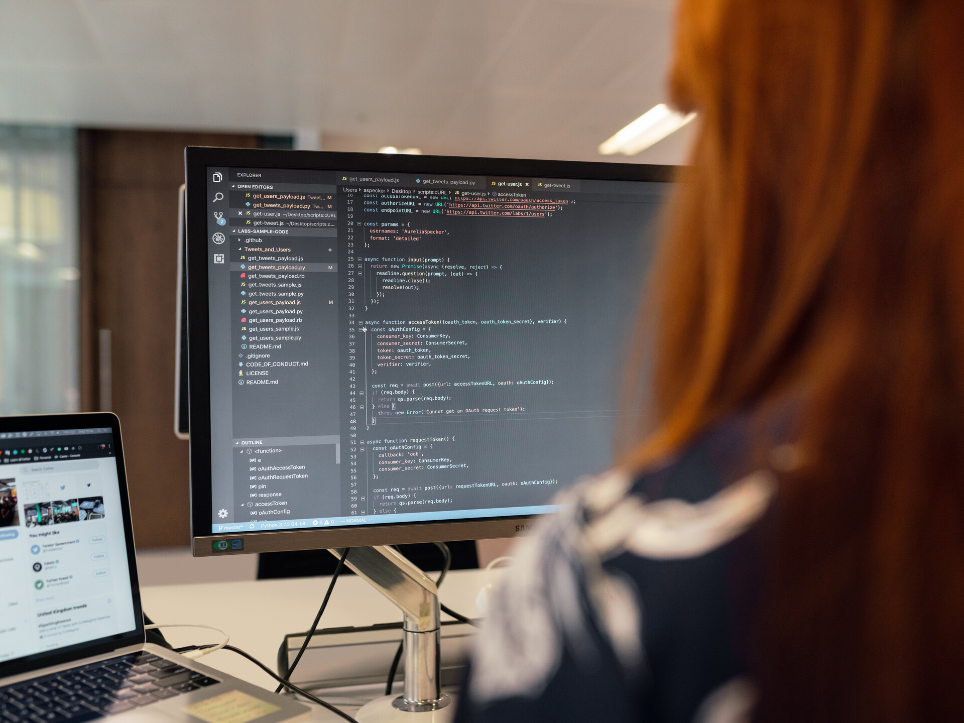 A programmer in front of a monitor